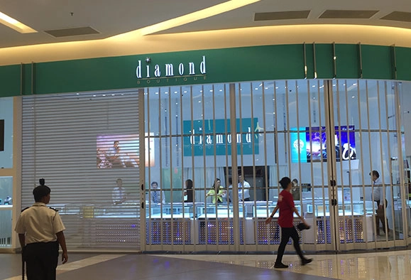 Diamond storefront with folding vertical shutter in Malaysia
