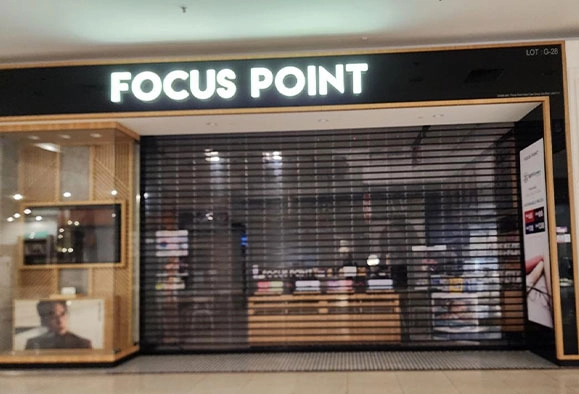 Focus Point storefront with roller shutter in Malaysia