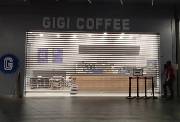 Gigi Coffee storefront with roller shutter in Malaysia